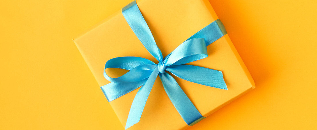 A gift package on a yellow background